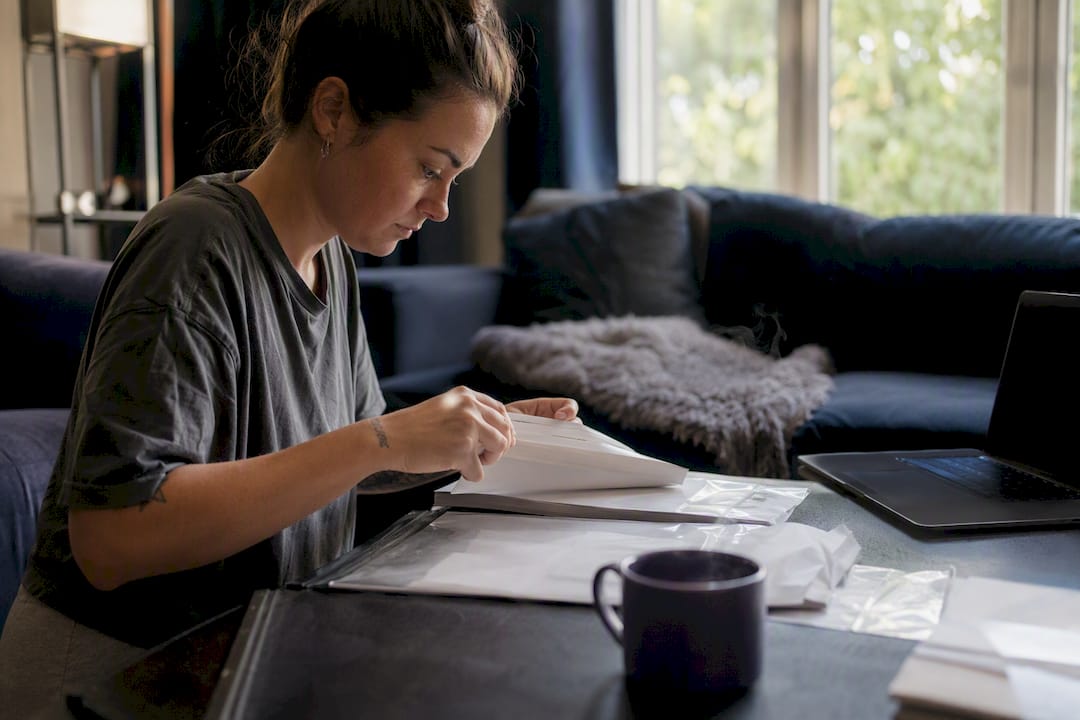 Person typing at laptop to search database