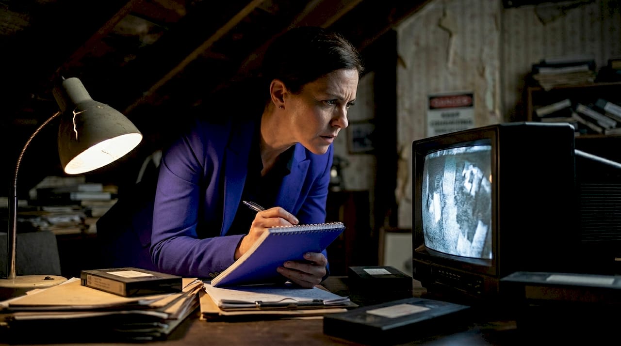 Detective reviewing old, poor quality video footage