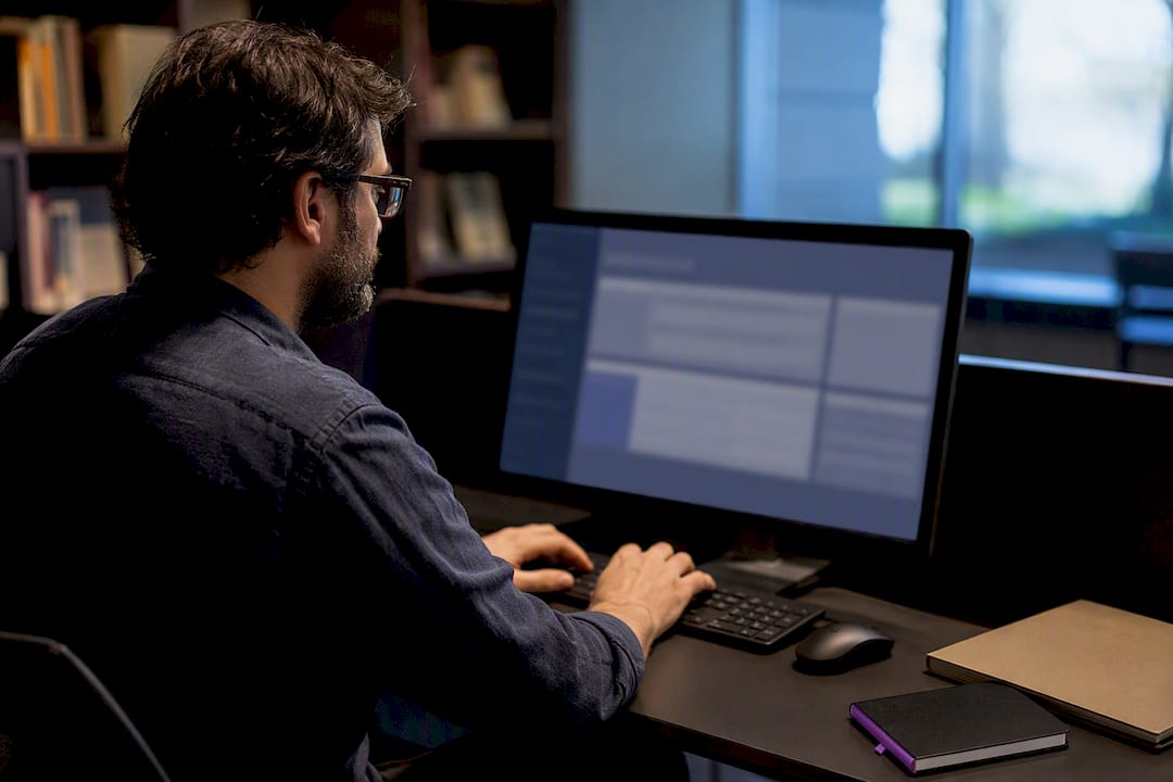 Researcher comparing state cold-case databases