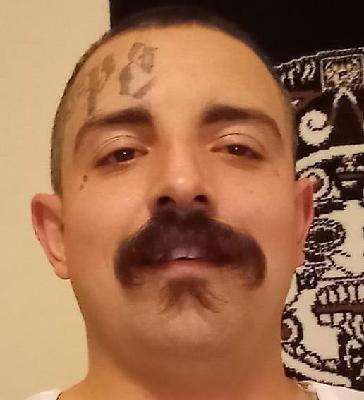 Portrait shared in memory of Miguel Lawrence Garza